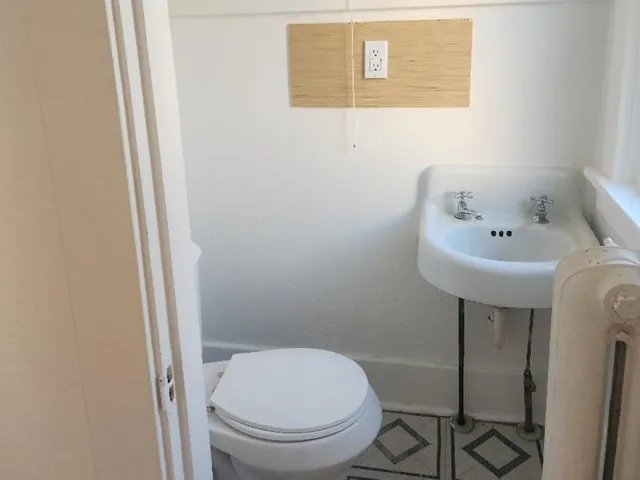 a view of hallway with wooden floor