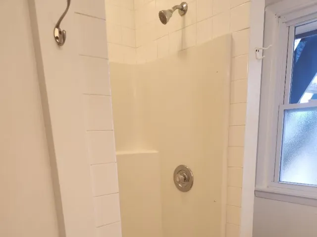 a view of an empty room with a window