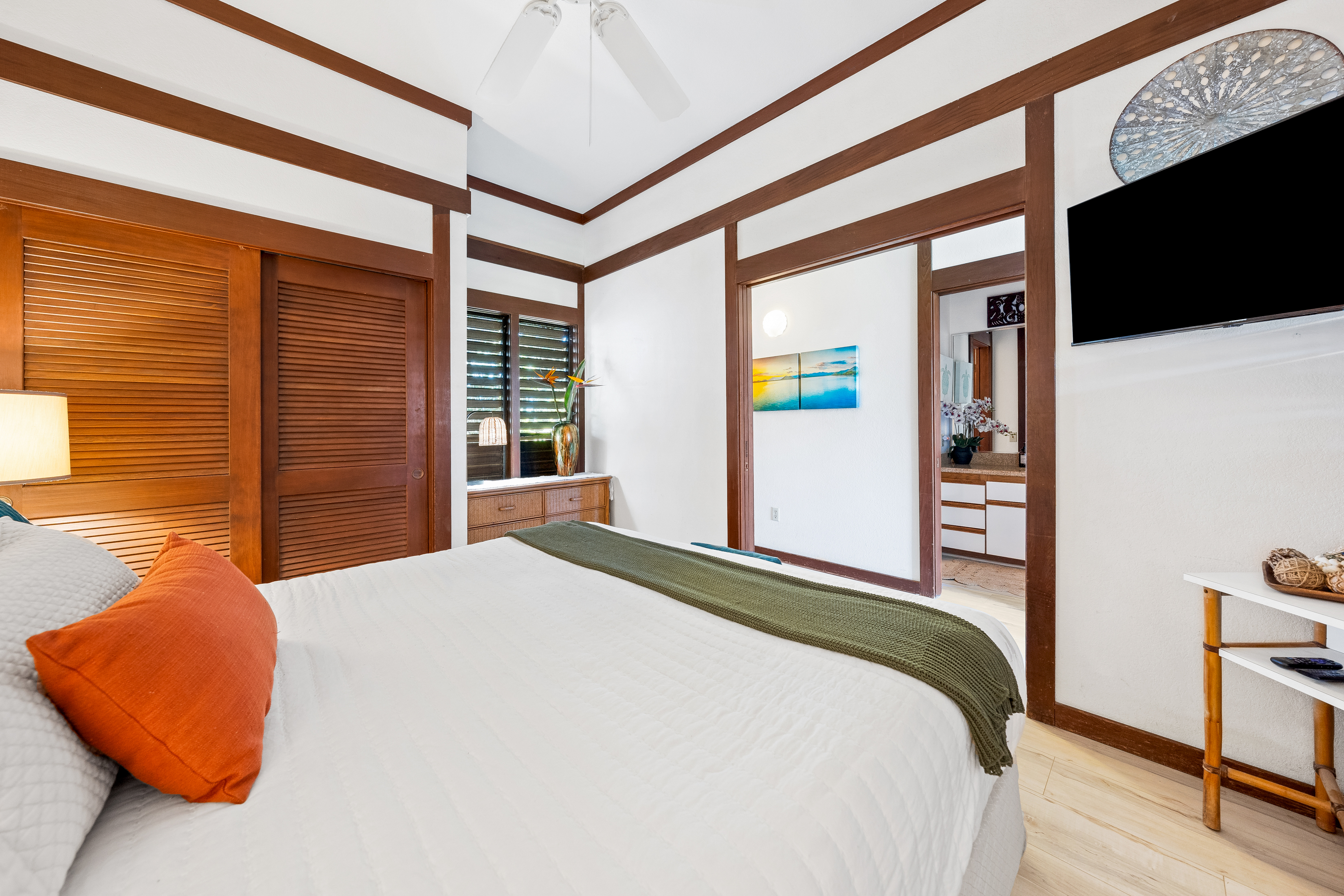 2253 Poipu Road, Unit 85 Koloa, HI 96756 - Photo 11 of 14 a bedroom with a bed and a flat screen tv