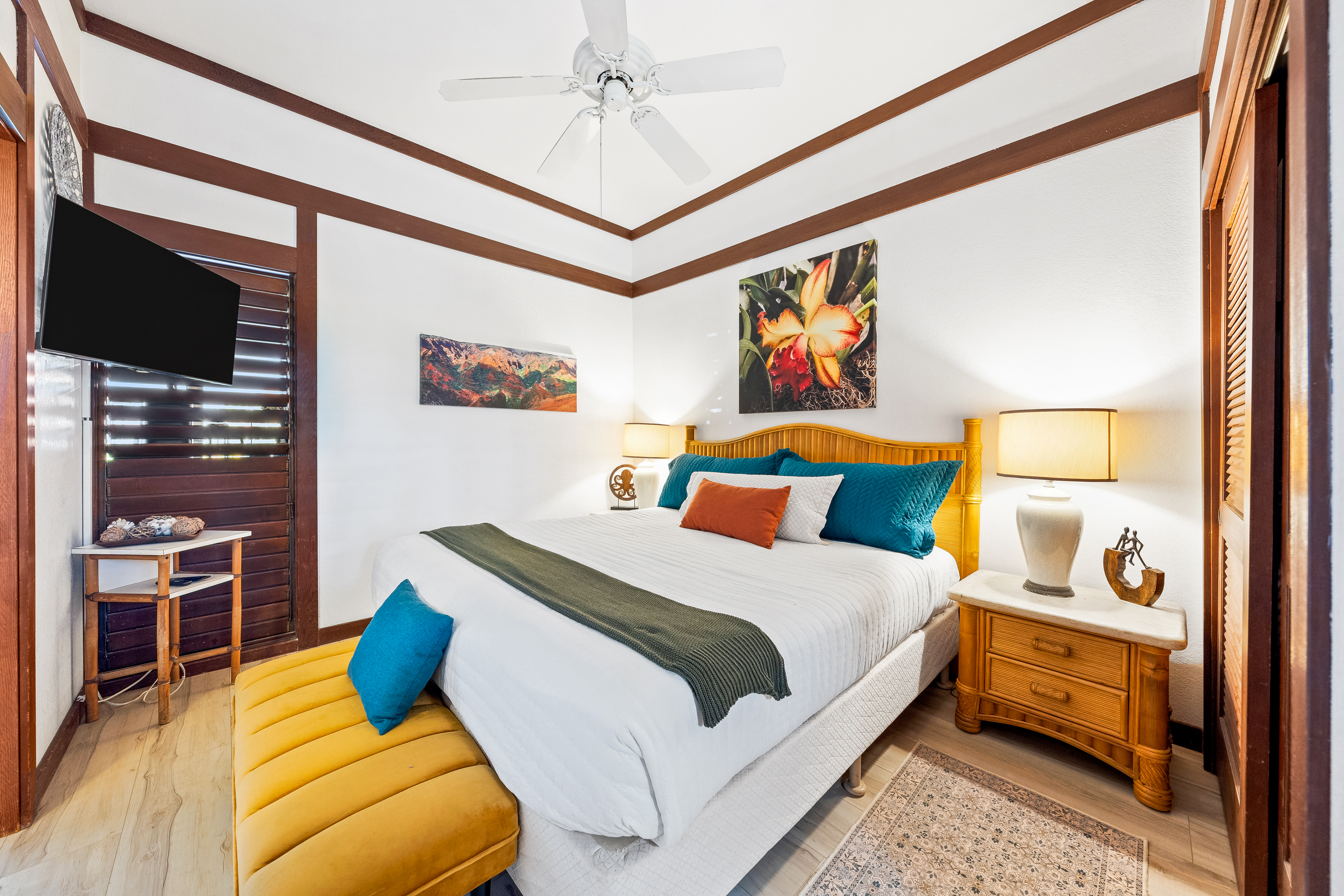 2253 Poipu Road, Unit 85 Koloa, HI 96756 - Photo 12 of 14 a bedroom with a bed and wooden floor