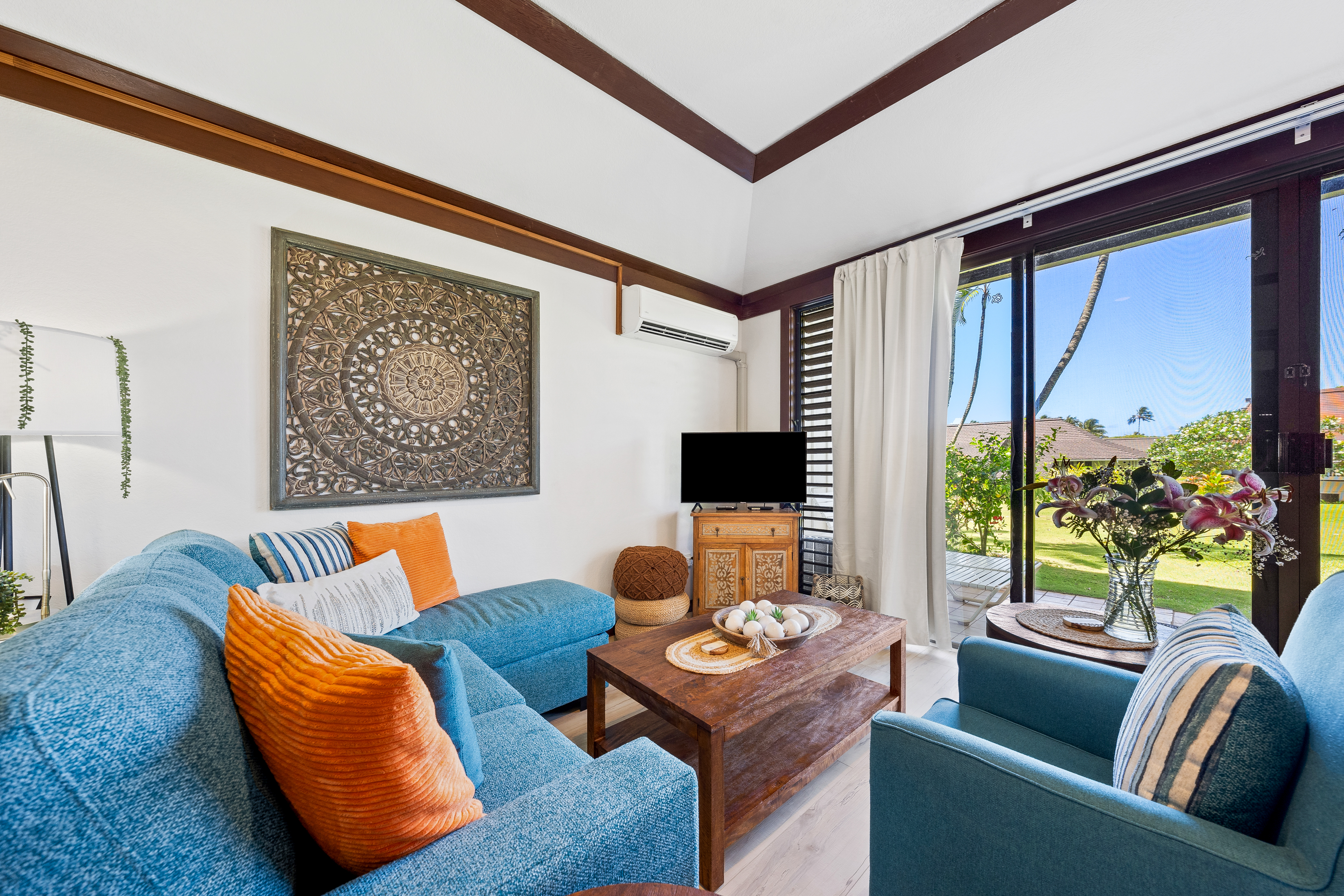 2253 Poipu Road, Unit 85 Koloa, HI 96756 - Photo 2 of 14 a living room with furniture and a flat screen tv