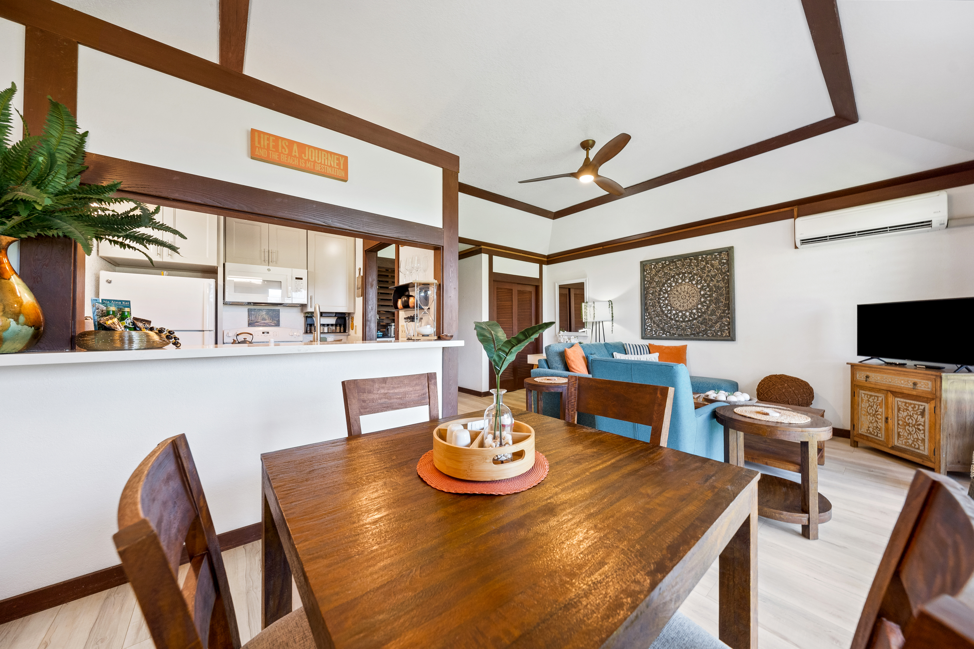 2253 Poipu Road, Unit 85 Koloa, HI 96756 - Photo 9 of 14 a view of a dining room with furniture and a large window