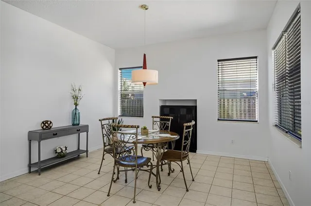 a en suite bathroom with a granite countertop sink and a mirror
