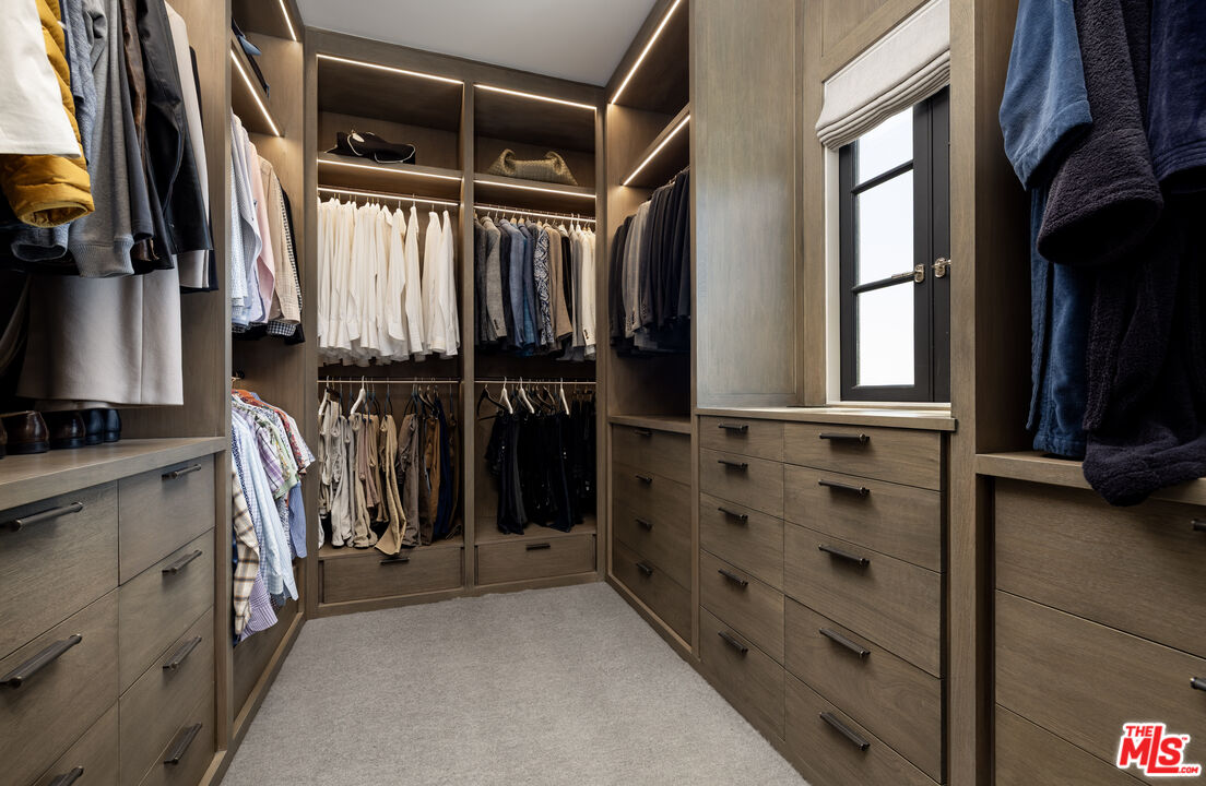 1140 East Mountain Drive Santa Barbara, CA 93108 - Photo 21 of 42 a view of walk in closet with clothes and shoes