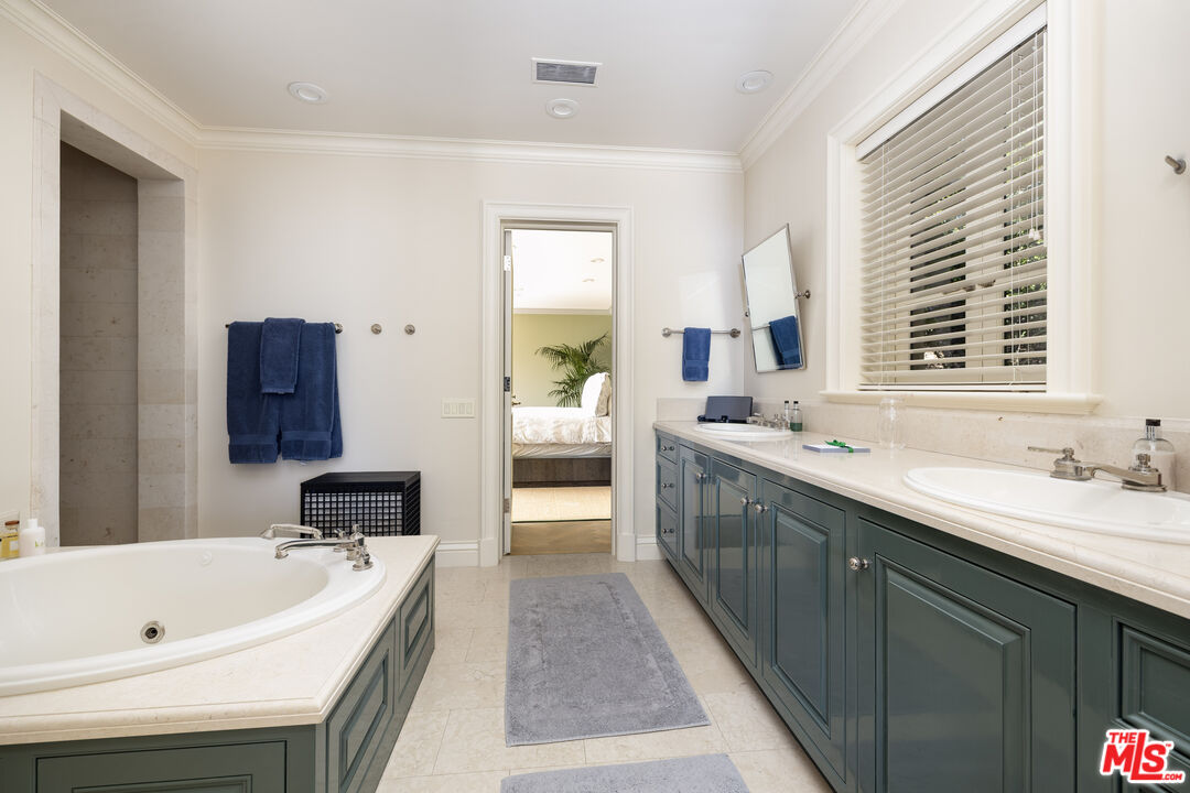 1140 East Mountain Drive Santa Barbara, CA 93108 - Photo 27 of 42 a spacious bathroom with a double vanity sink a mirror and a bathtub
