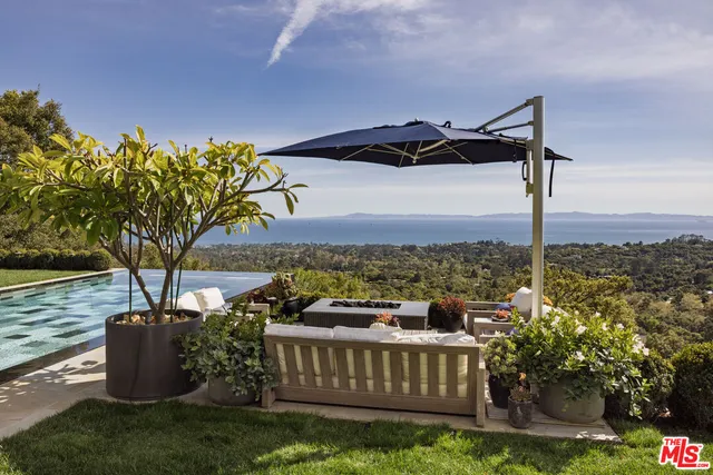 a view of a chairs and table in the patio