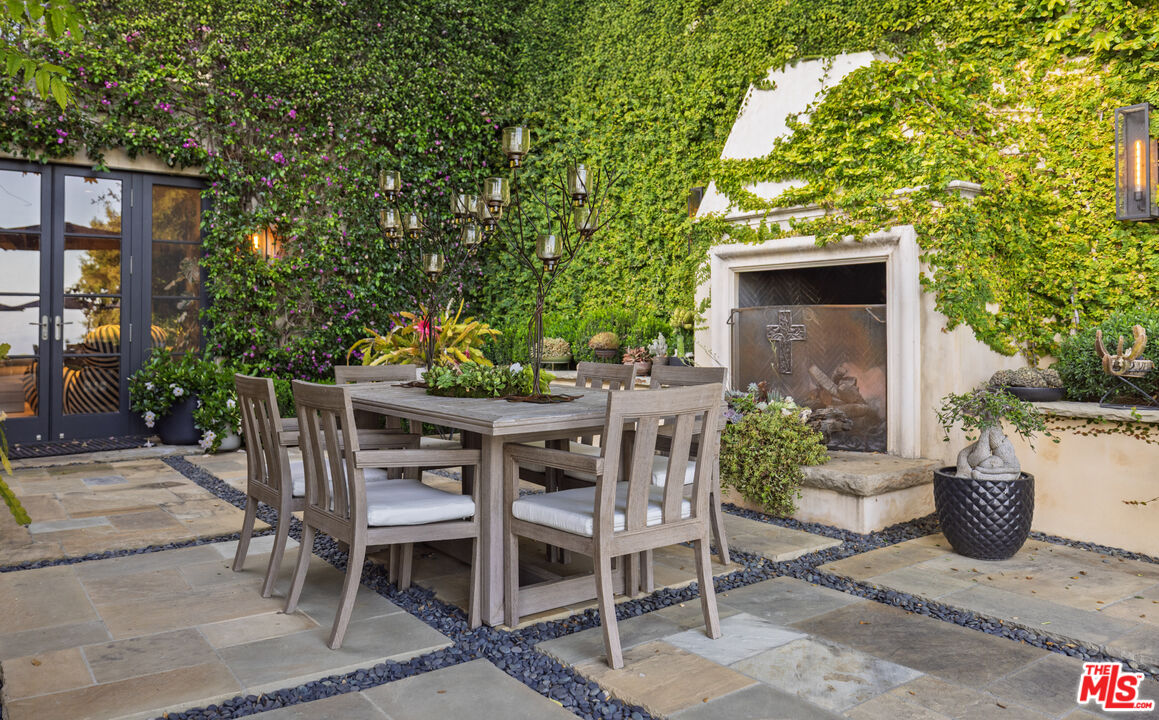 1140 East Mountain Drive Santa Barbara, CA 93108 - Photo 38 of 42 a view of a patio with table and chairs and potted plants
