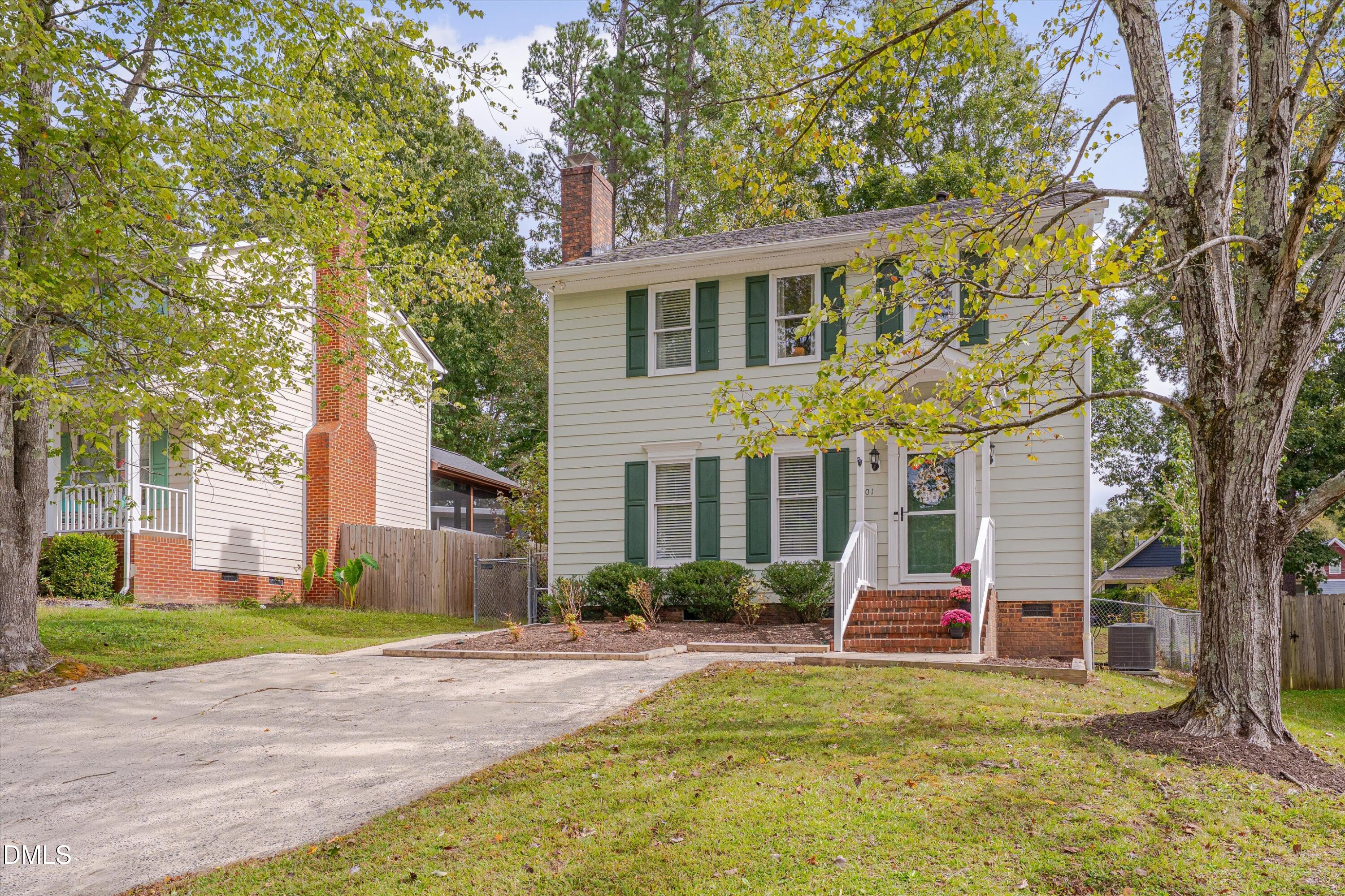 3301 Lassiter Street Durham, NC 27707 - Photo 3 of 32 a view of a house with a yard and large tree