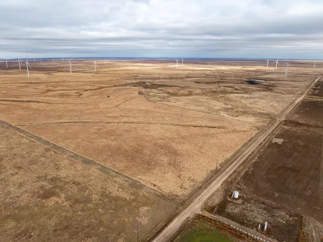 a view of a swimming pool and an outdoor space
