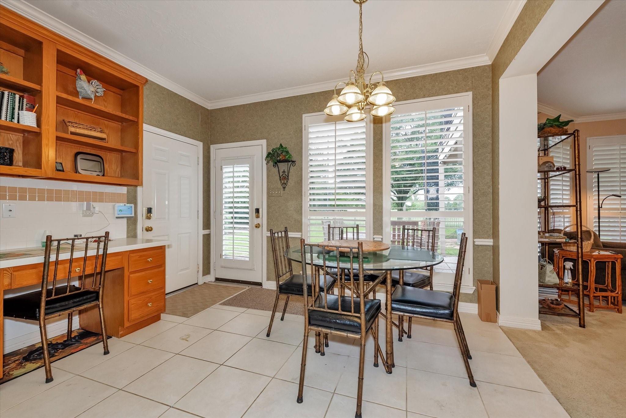 5718 Oakmoss Trail Spring, TX 77379 - Photo 18 of 50 Bright dining area with serene backyard views, seamlessly connected to the kitchen for effortless living.