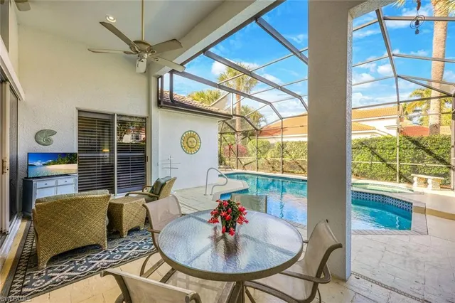 a living room with patio furniture and a window
