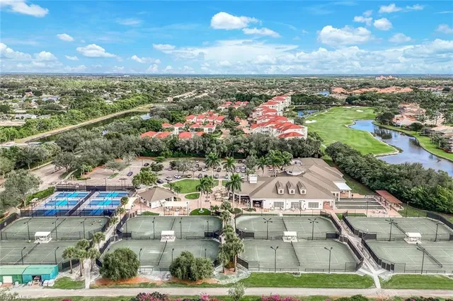 a view of a city with lots of residential buildings ocean and mountain view in back