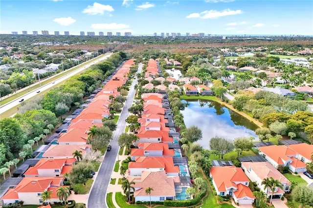 an aerial view of residential building and lake