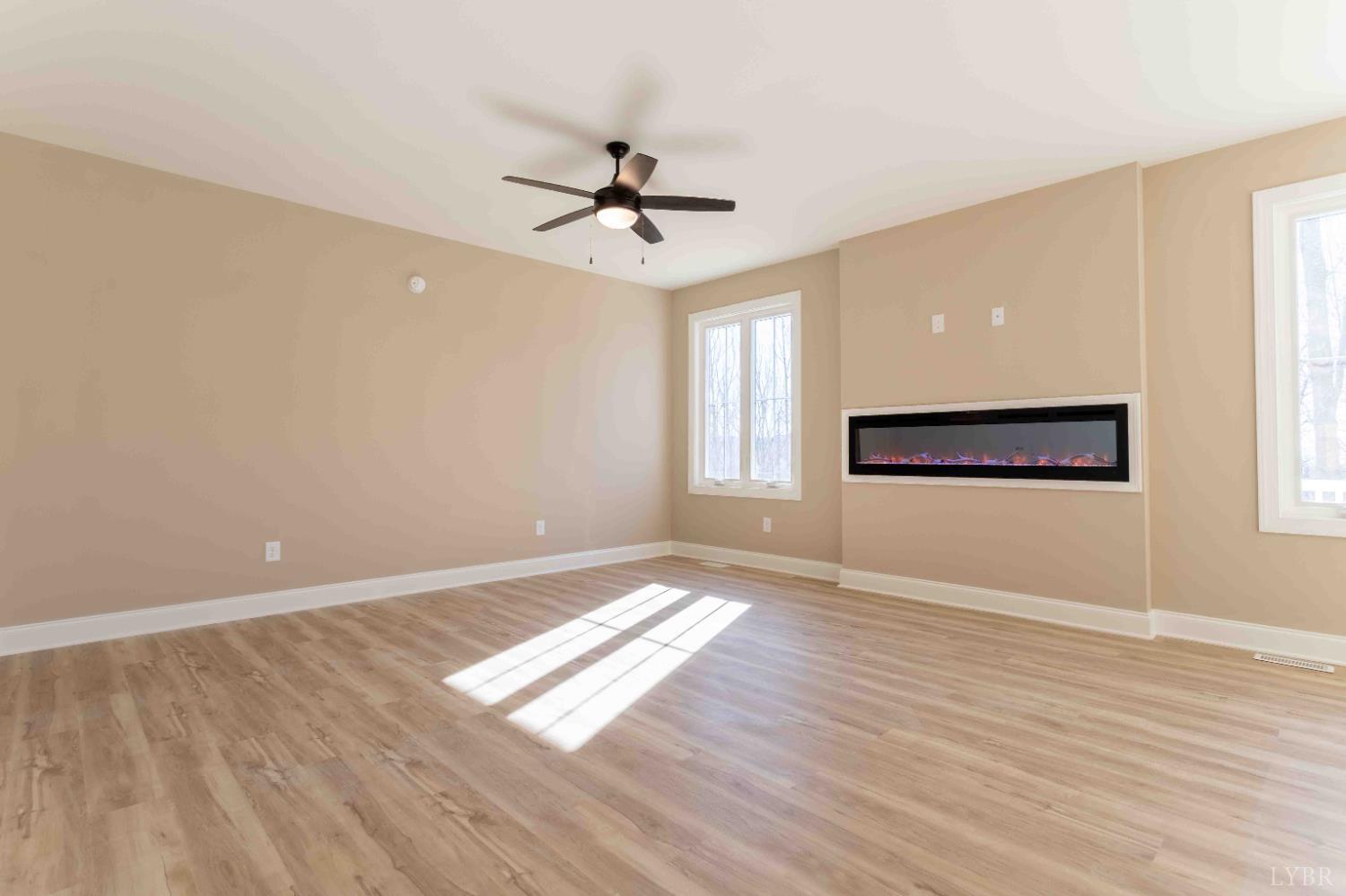 1115 Thornblade Way Blue Ridge, VA 24064 - Photo 13 of 44 an empty room with windows and fan