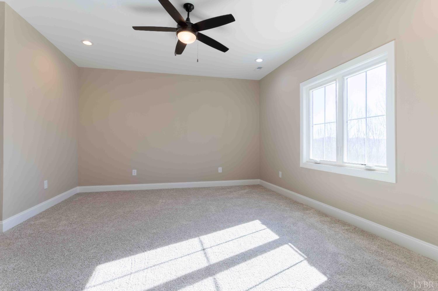 1115 Thornblade Way Blue Ridge, VA 24064 - Photo 23 of 44 a view of a livingroom with a ceiling fan and window