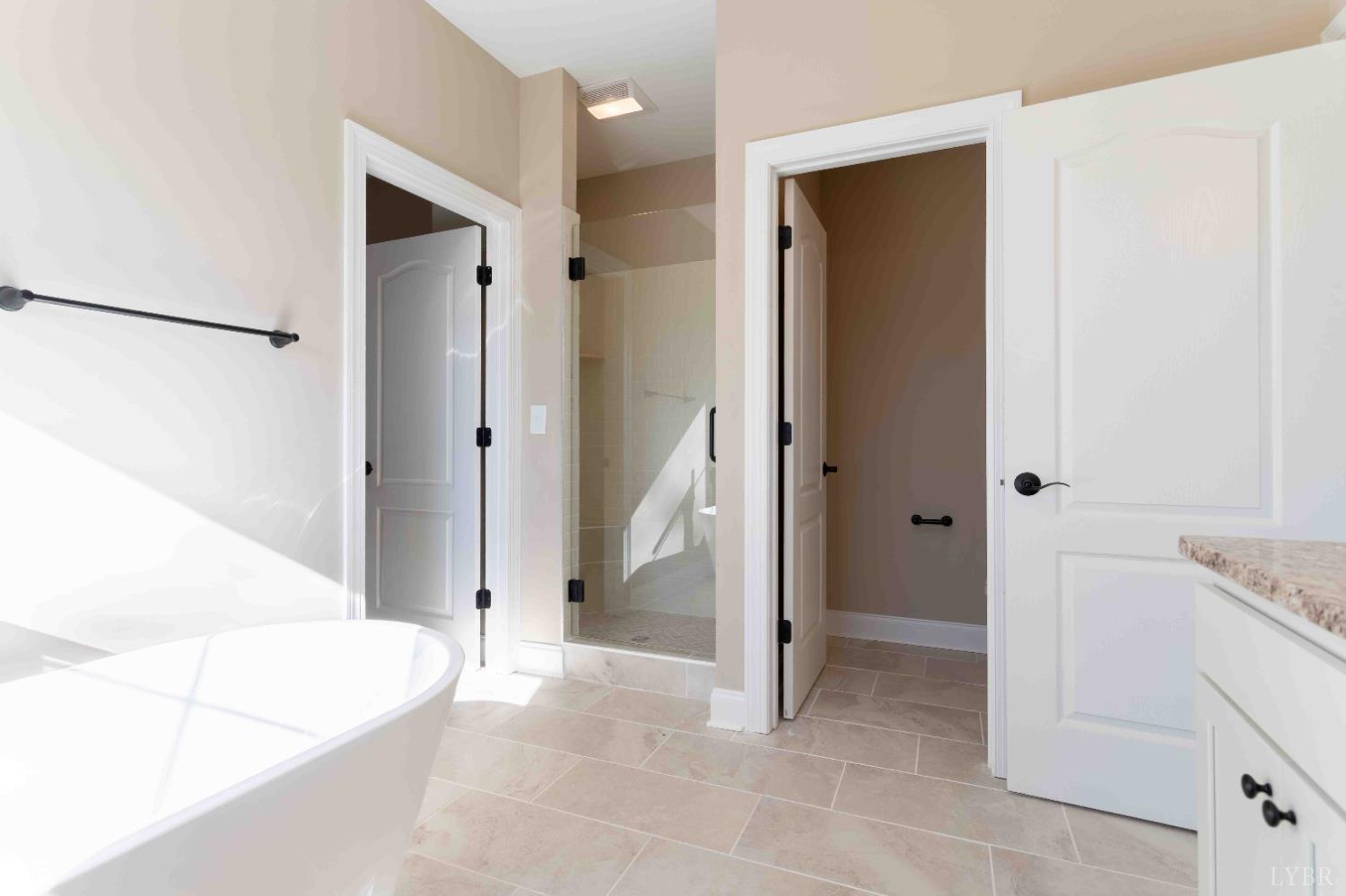 1115 Thornblade Way Blue Ridge, VA 24064 - Photo 31 of 44 a view of a bathroom with a tub and shower