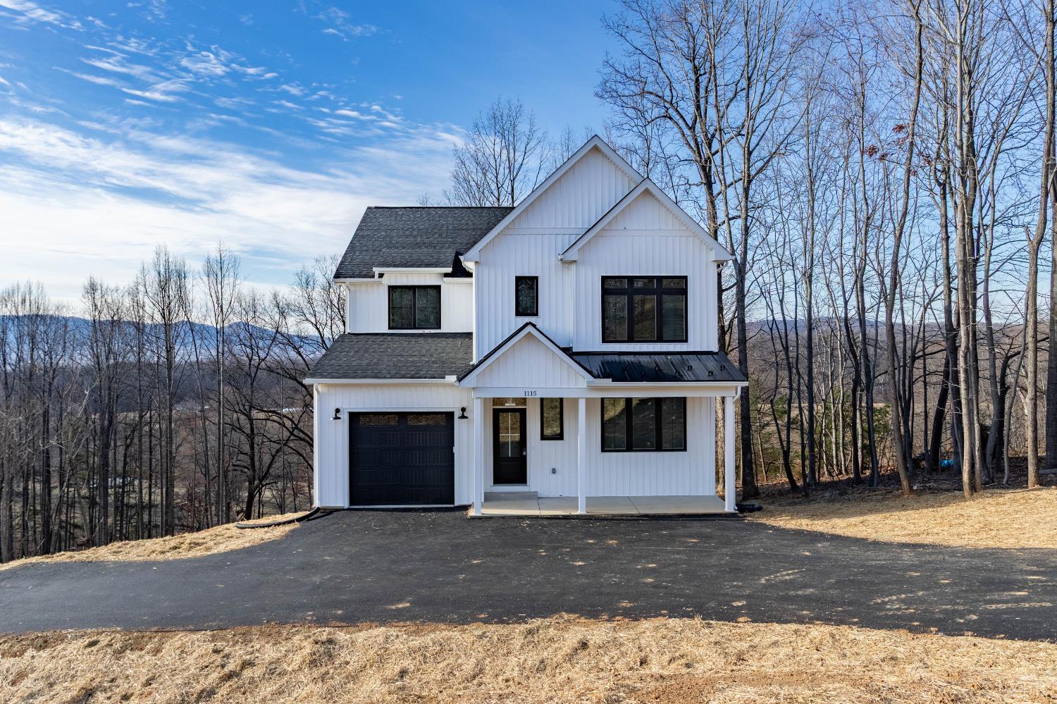 1115 Thornblade Way Blue Ridge, VA 24064 - Photo 41 of 44 a front view of a house with a yard