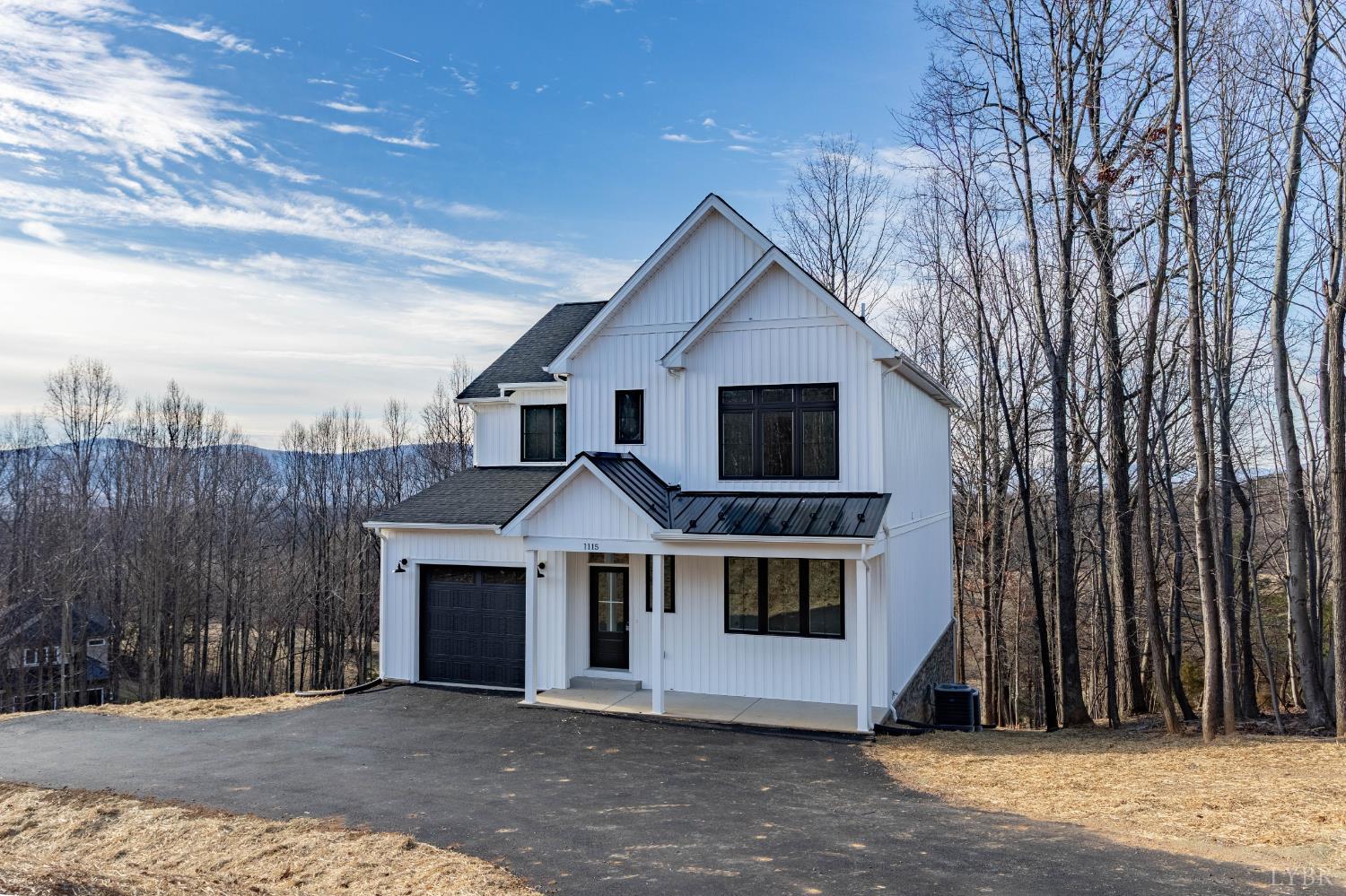 1115 Thornblade Way Blue Ridge, VA 24064 - Photo 42 of 44 a front view of a house with a yard