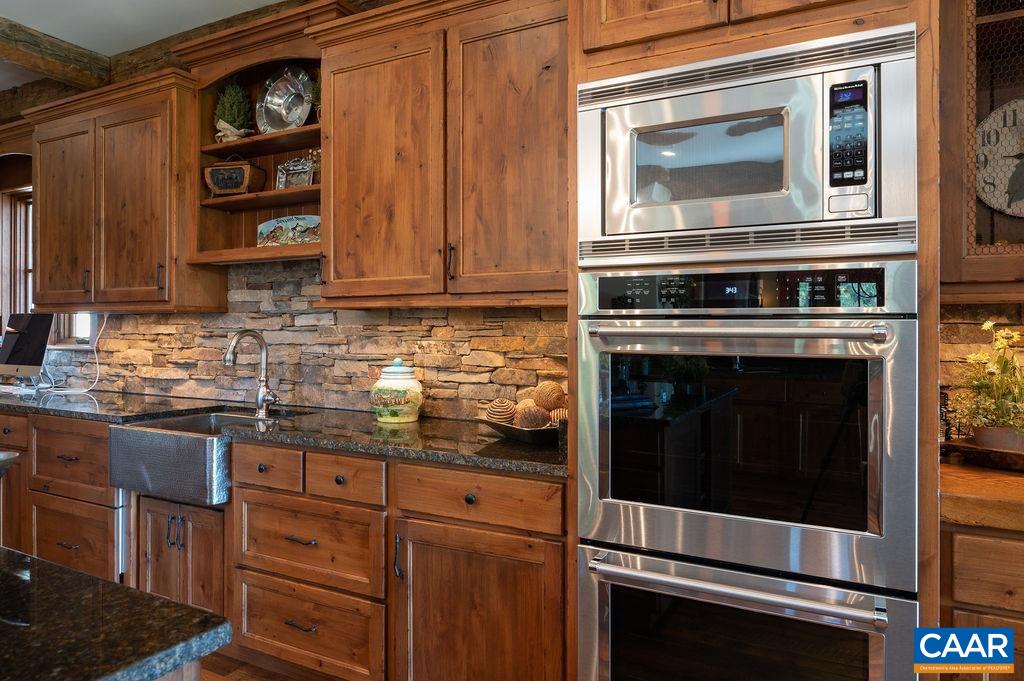 5095 Wesley Chapel Road Free Union, VA 22940 - Photo 24 of 75 a kitchen with granite countertop cabinets stainless steel appliances and wooden floor