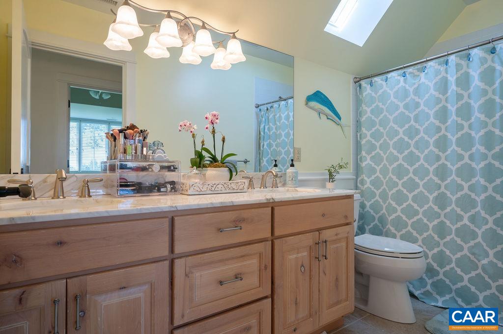 5095 Wesley Chapel Road Free Union, VA 22940 - Photo 39 of 75 a bathroom with a double vanity sink mirror and toilet