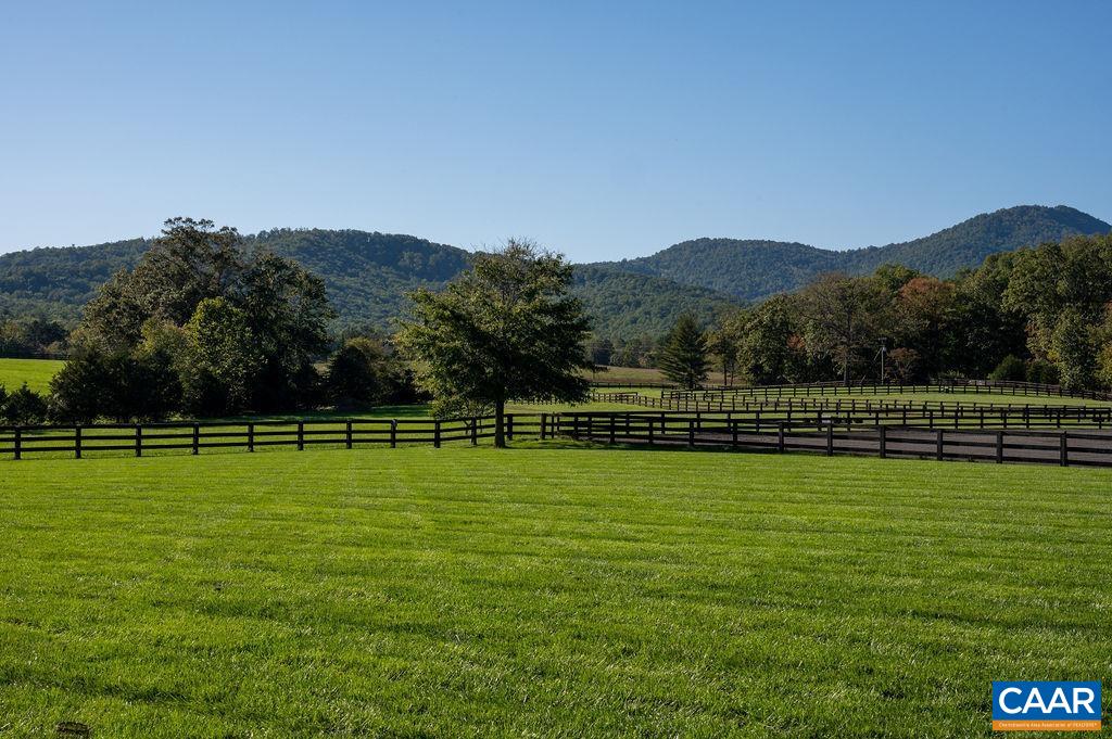 5095 Wesley Chapel Road Free Union, VA 22940 - Photo 48 of 75 a view of a golf course with a lake