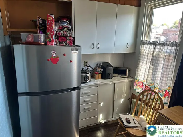 a white refrigerator freezer sitting inside of a kitchen