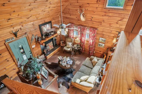 a bedroom with bed and wooden floor