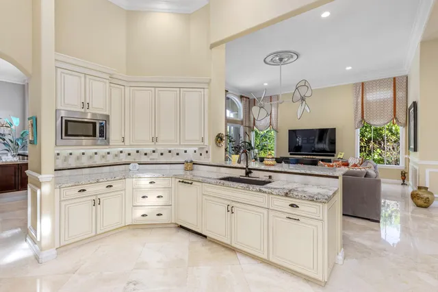 a view of a dining room with furniture and window