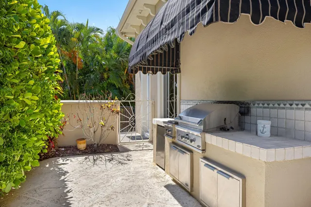 a bathroom with a toilet a sink a tub and a mirror