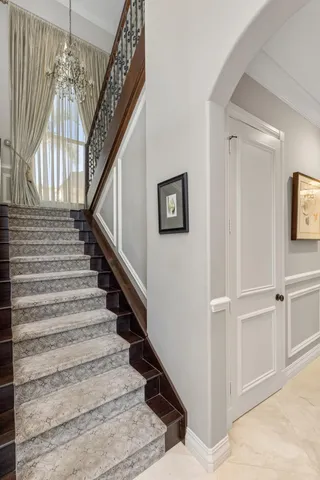 a view of a workspace with furniture and a bookshelf