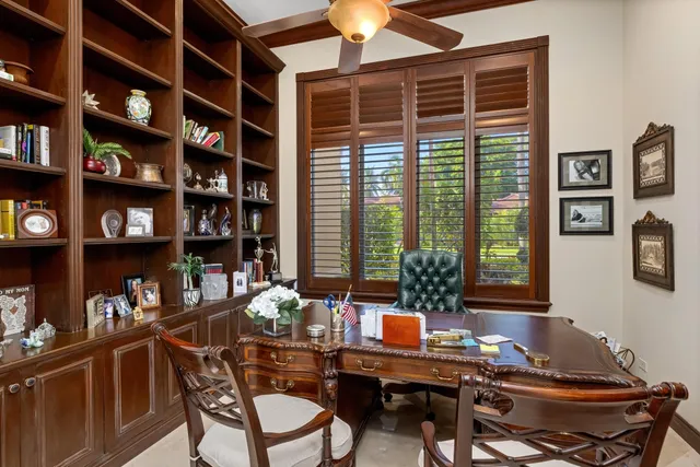 a living room with patio area and a chandelier
