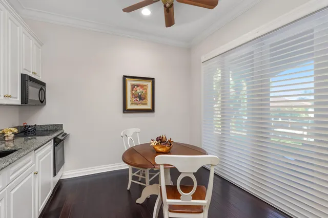 an aerial view of residential houses with outdoor space and swimming pool
