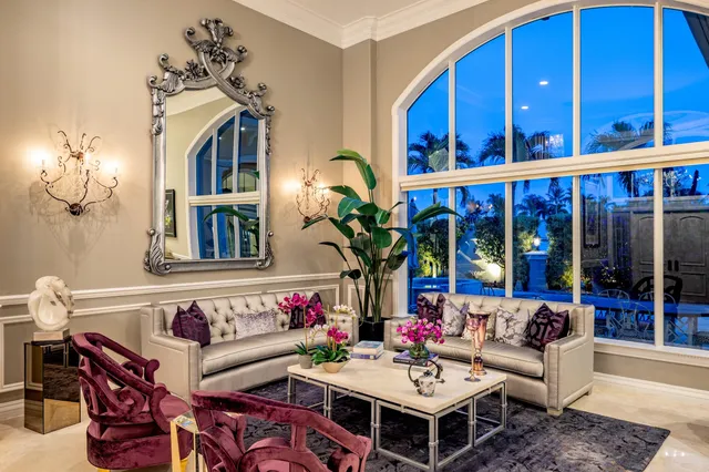 an aerial view of residential houses with outdoor space and swimming pool