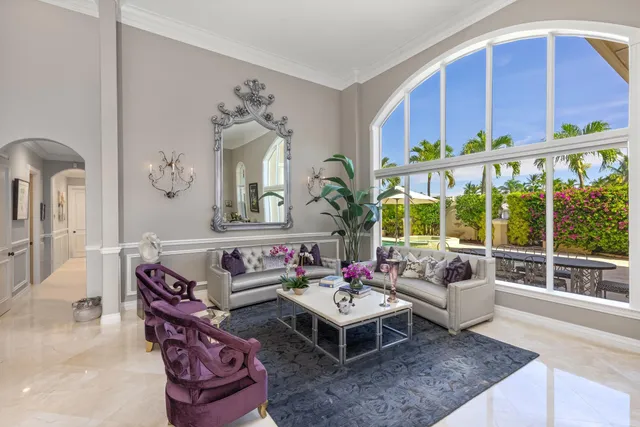 a living room with furniture fireplace and window