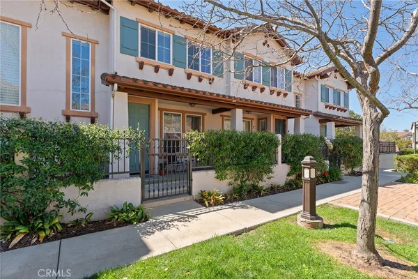 a front view of a building with garden