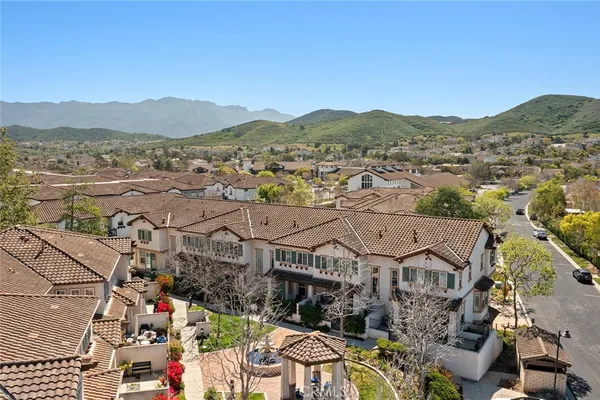 an aerial view of residential building and trees