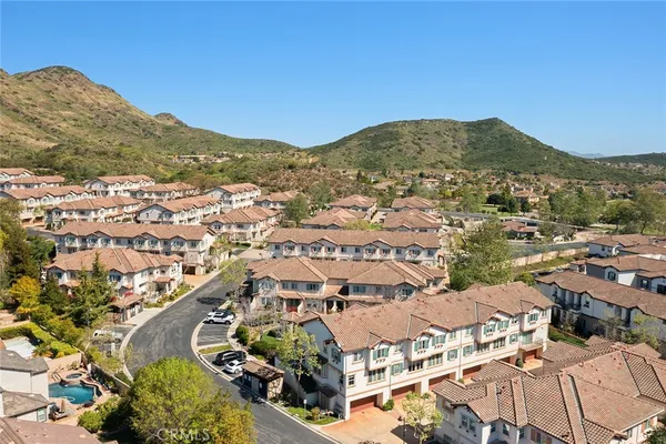 an aerial view of residential houses with outdoor space