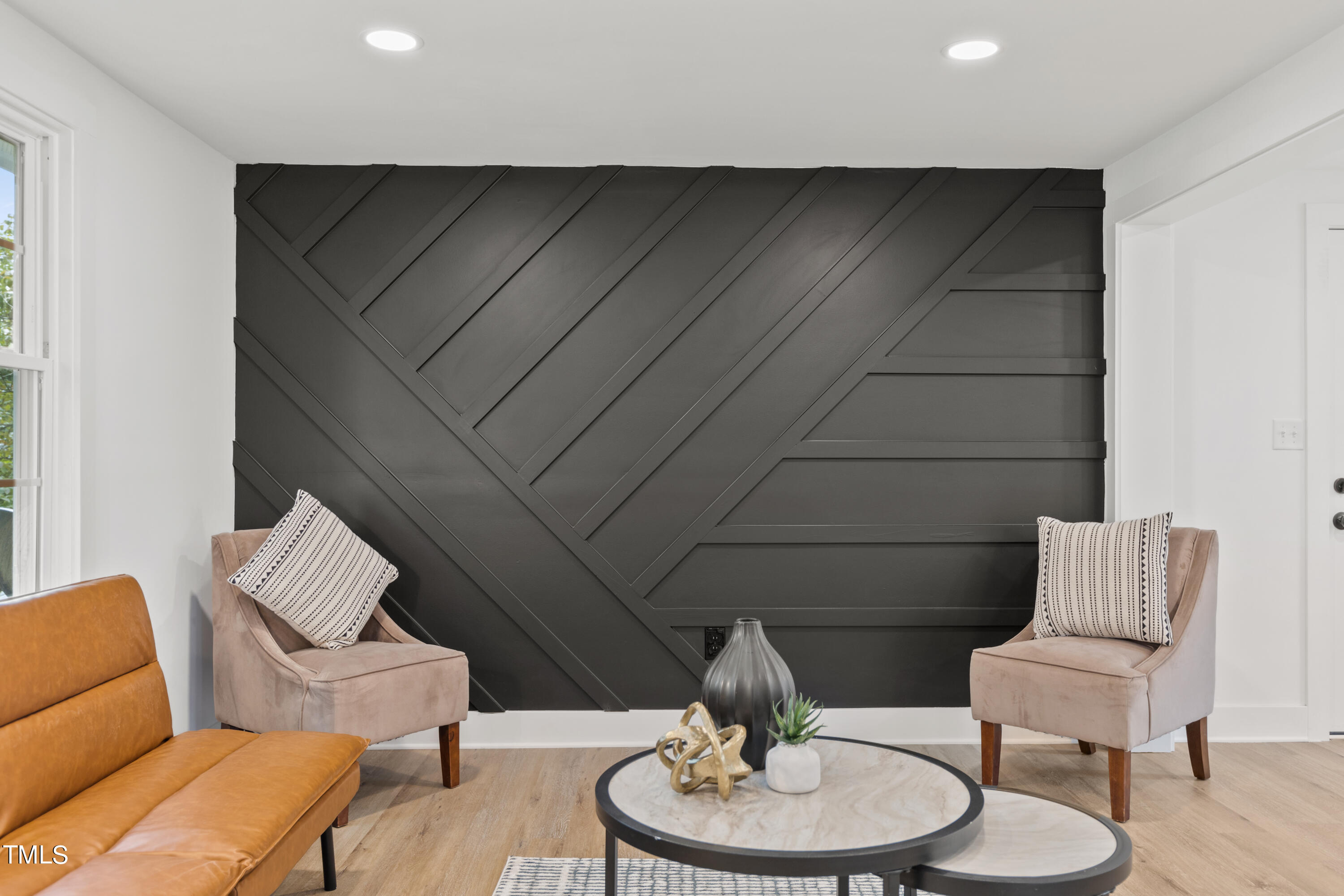 4721 Kimbro Road Hillsborough, NC 27278 - Photo 2 of 11 a living room with furniture and a chair