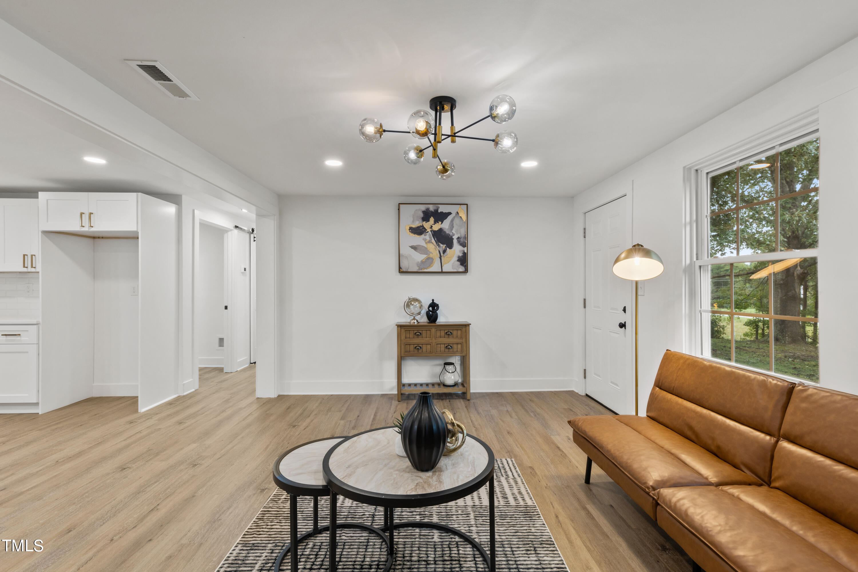 4721 Kimbro Road Hillsborough, NC 27278 - Photo 4 of 11 a living room with furniture and a window