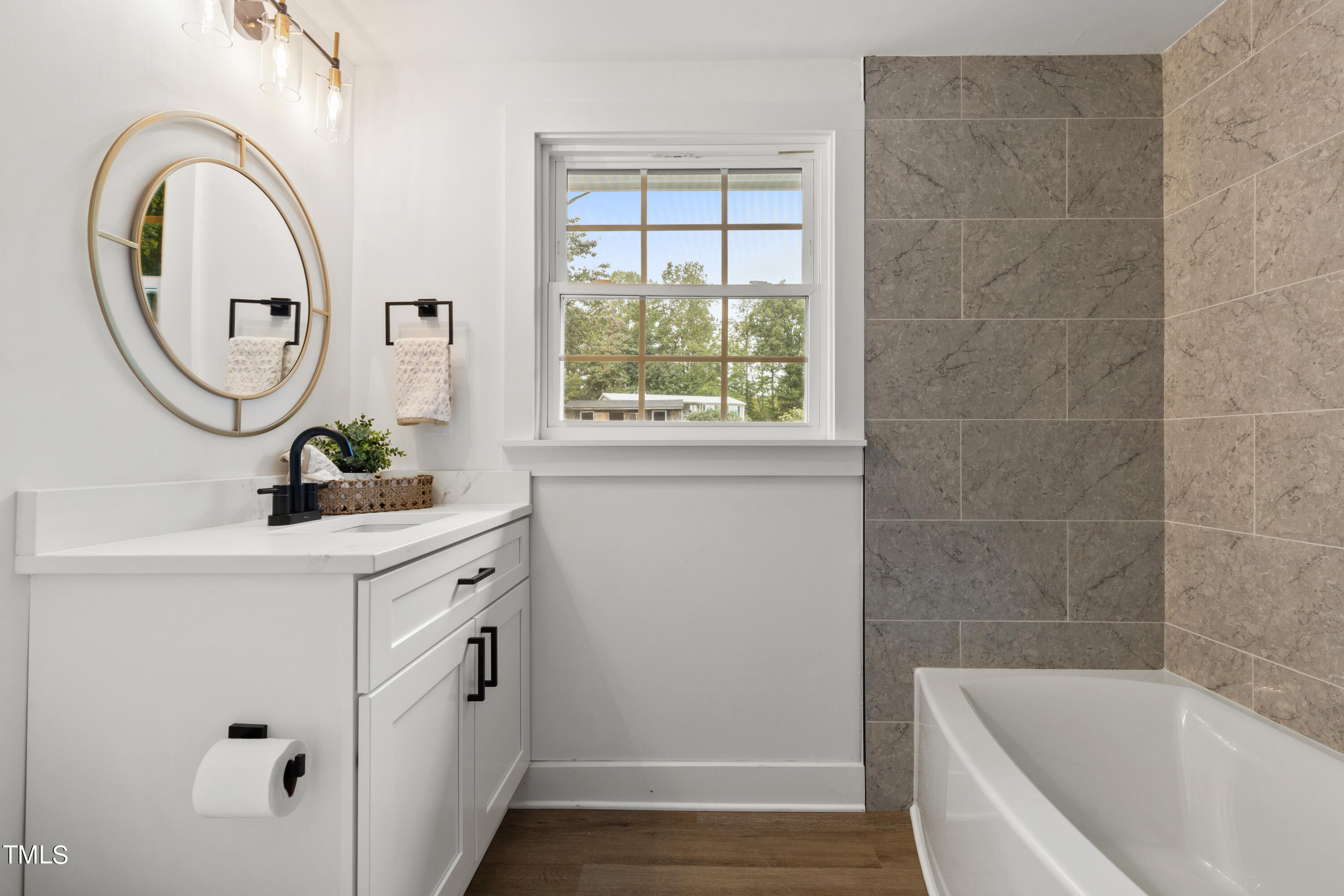 4721 Kimbro Road Hillsborough, NC 27278 - Photo 7 of 11 a bathroom with a granite countertop sink a mirror and a bathtub