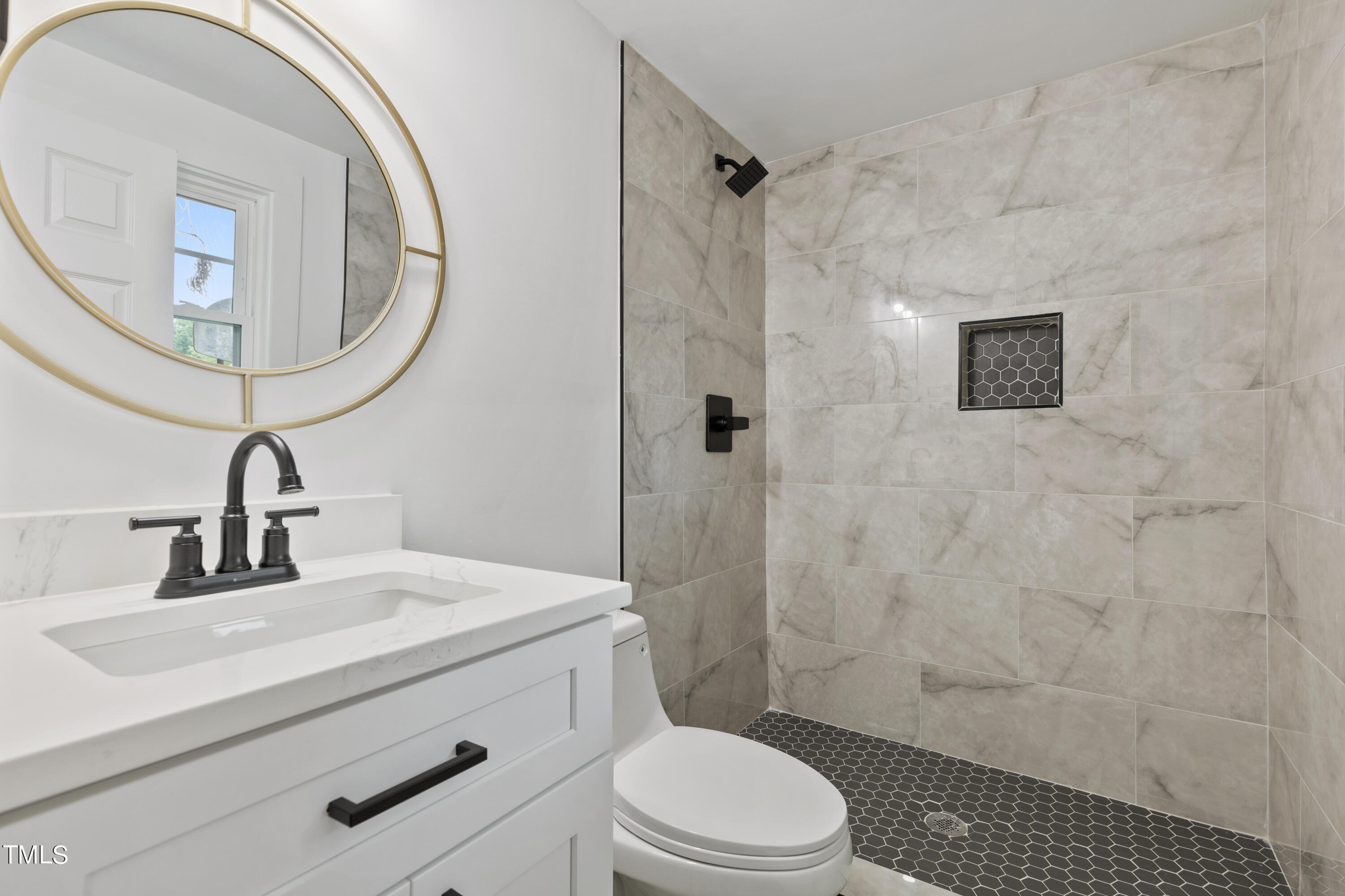 4721 Kimbro Road Hillsborough, NC 27278 - Photo 10 of 11 a bathroom with a sink a toilet and shower