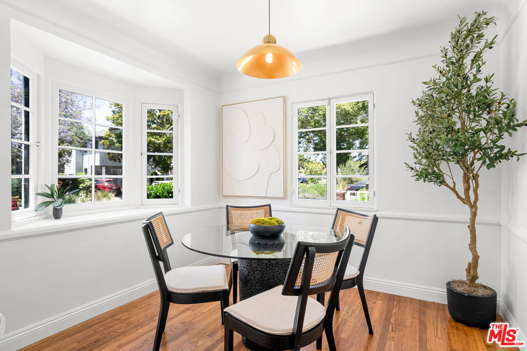 3340 Cardiff Avenue Los Angeles, CA 90034 - Photo 11 of 49 a view of a dining room with furniture and wooden floor