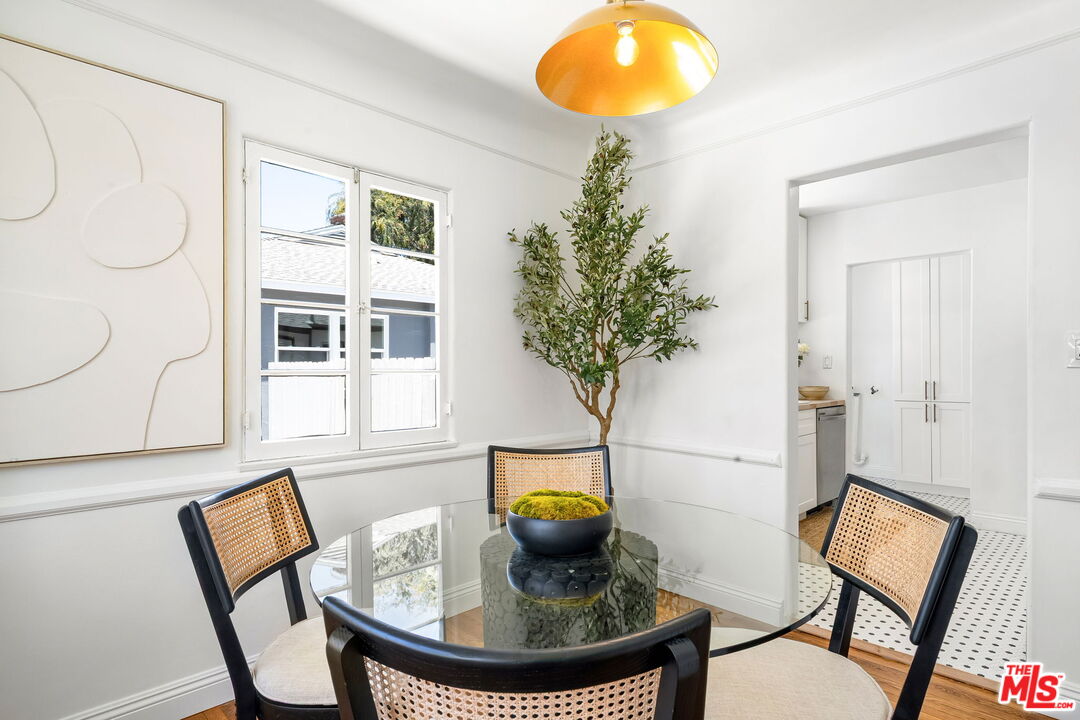 3340 Cardiff Avenue Los Angeles, CA 90034 - Photo 12 of 49 a view of a workspace with furniture and chandelier