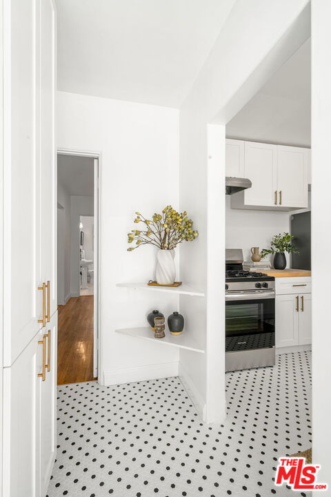 3340 Cardiff Avenue Los Angeles, CA 90034 - Photo 20 of 49 a kitchen with a sink and white cabinets