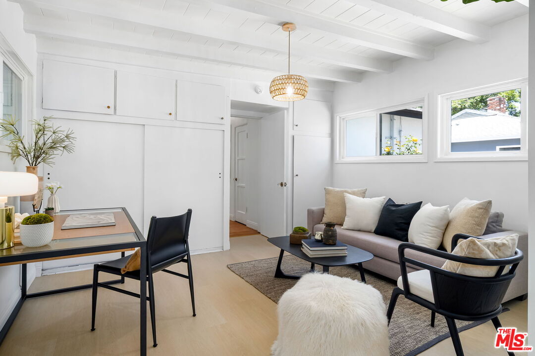 3340 Cardiff Avenue Los Angeles, CA 90034 - Photo 27 of 49 a living room with furniture a rug and a window