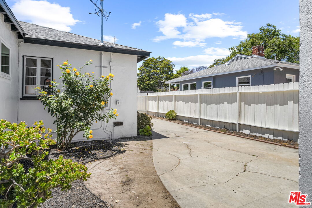 3340 Cardiff Avenue Los Angeles, CA 90034 - Photo 40 of 49 a view of a house with a yard and potted plants