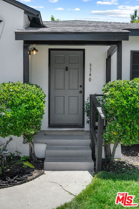 3340 Cardiff Avenue Los Angeles, CA 90034 - Photo 4 of 49 a front view of a house with a yard