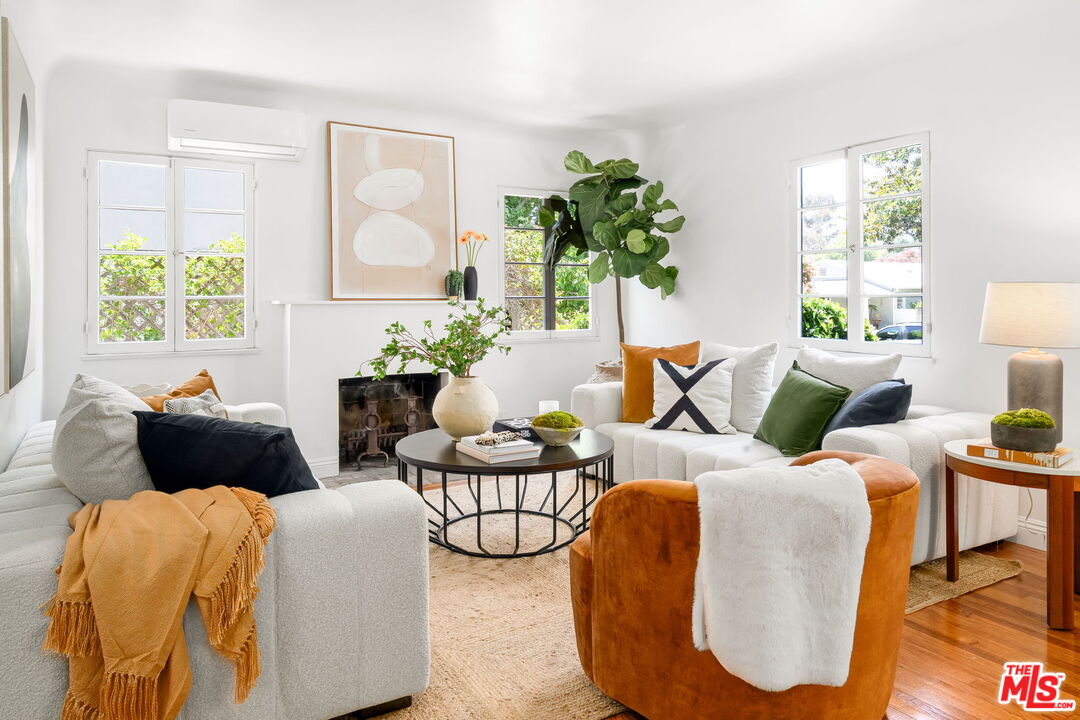 3340 Cardiff Avenue Los Angeles, CA 90034 - Photo 8 of 49 a living room with furniture and a potted plant