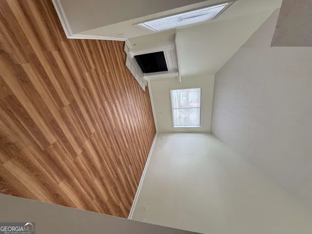 a view of livingroom and hardwood floor