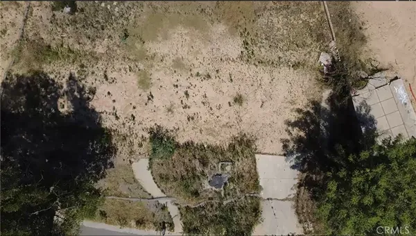 a aerial view of a house with a yard